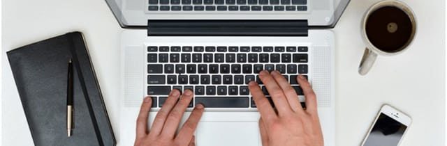 Start writing an article on a laptop.