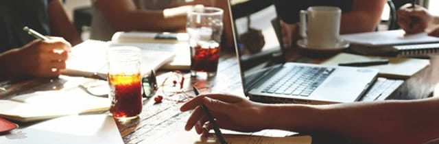 People checking mistakes on papers.